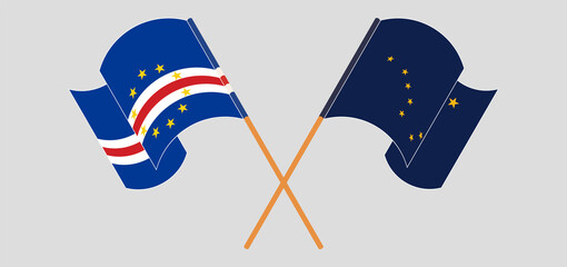 Crossed and waving flags of Cape Verde and the State of Alaska