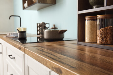 Counter with wooden table top in kitchen, closeup