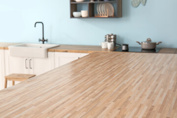 Wooden table top in stylish kitchen, closeup
