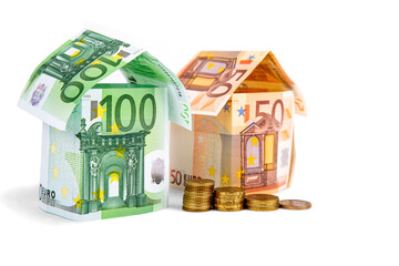 houses made of euro bills, isolated on a white background