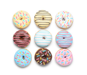 Different delicious donuts on white background
