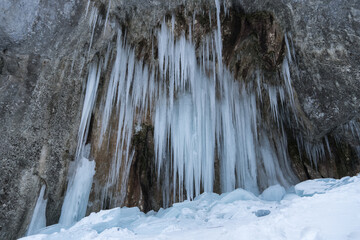 waterfall in winter,  Sapte Scari Canyon, Piatra Mare Mountains, Romania 