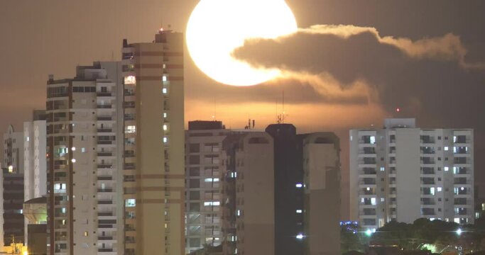 Super Moon - Real Scene Big Moon rising behind the buildings