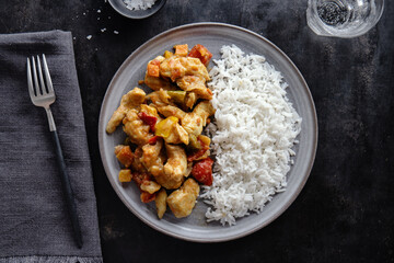Tasty chicken fried with vegetables and rice