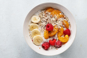 Porridge in bowl with fruits