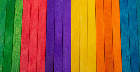 Rainbow of colors made with wooden sticks