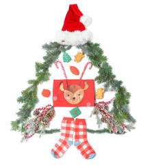 Christmas tree made of clothes, fir branches and decorations on white background