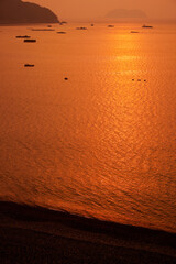 Beautiful sunrise at Black pearl Mongdol Beach in Geoje-si, South Korea.
