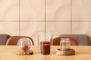 Stylish decor with candle on wooden table in dining room
