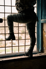 woman climbing a grid