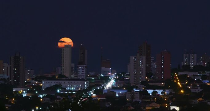 Super Moon - Real Scene Big Moon rising behind the buildings