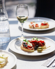 traditional wine appetizers. white and red wine. restaurant serving. summer mood. shallow depth of field