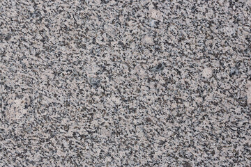 Granite texture. Natural granite with a grainy pattern. Stone background. Solid rough surface of...