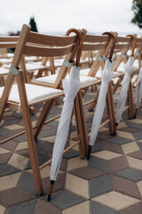 Fototapeta na wymiar wedding ceremony preparation, wooden folding chairs