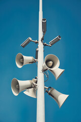 Vertical shot of Security system with video surveillance and megaphones in the open air