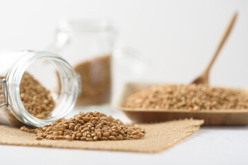 Whole wheat seedl on white background. Natural product, healthy baking ingredient