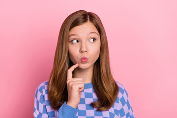 Photo of young pretty lady think finger touch chin look empty space ponder idea isolated over pink...
