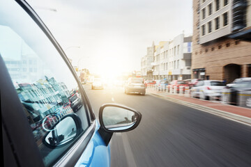 Always on the move. Shot of a car driving on a road.