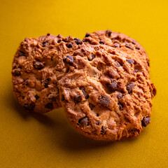 chocolate cookies on yellow background 