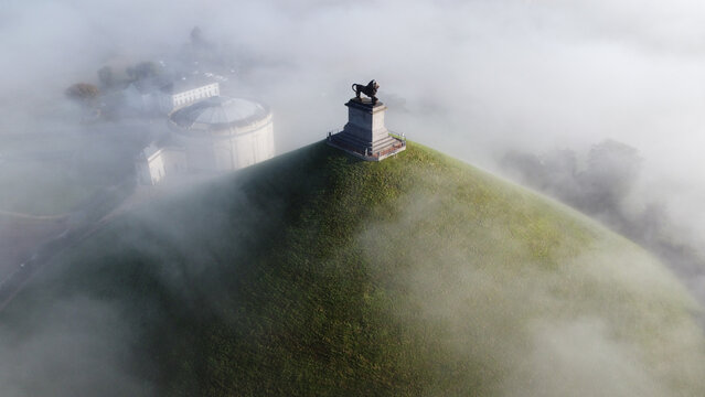 Bird's Eye View Of Lion's Mound Hill On The Battlefield Of Waterloo Surrounded By Fog, Belgium