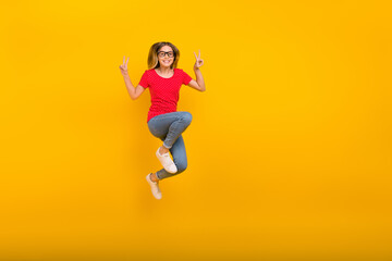 Full size photo of young energetic girl show peace v-symbol travel isolated over yellow color background