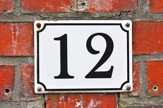 White house number plaque, showing the number twelve