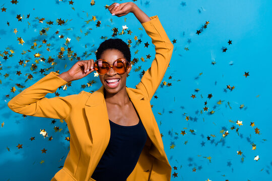 Portrait of funky crazy lady arm touch glasses clubbing fly star confetti isolated on blue color background