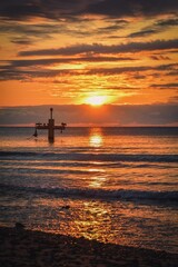 Colorful dreamlike morning by the sea. Beautiful sunrise over the Polish sea in Gydnia.