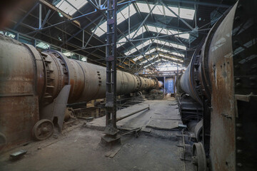 Fototapeta na wymiar he idle and abandoned cement rotary kiln is in a factory, North China