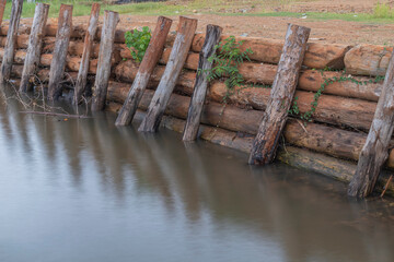 wooden fence over river