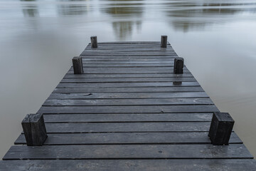 slow shutter speed of wooden pier on the river