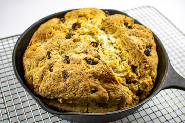 Irish soda bread baked in a cast iron pan.