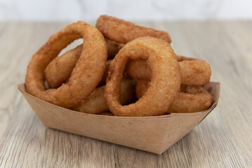 Side order appetizer of deep fried onion rings always tastes wonderful to eat