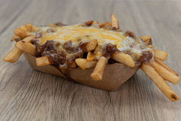 Huge calorie consumption with this side order of chili cheese fries served in a boat for a big...