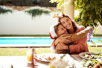 Family is what makes Christmas so special. Cropped shot of a girl girl and her mother enjoying Christmas lunch together.