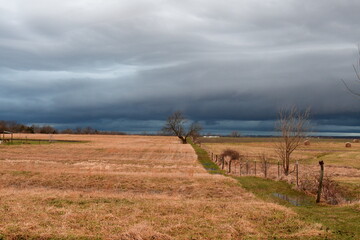 Storm Clouds Over a Farm Field