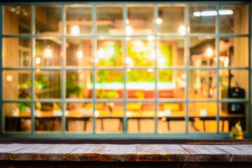 Selective focus of wooden table in front of decorative indoor string lights. Christmas, festival and holiday concepts, can used for display or montage your product