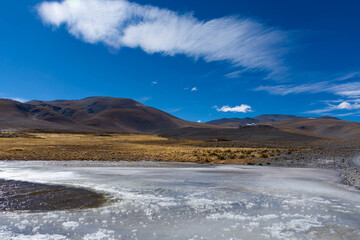 Frozen river with mountains in Patagonia, Argentina © Matther Ph/Wirestock Creators