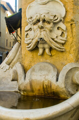 renaissance fountain on a street corner
