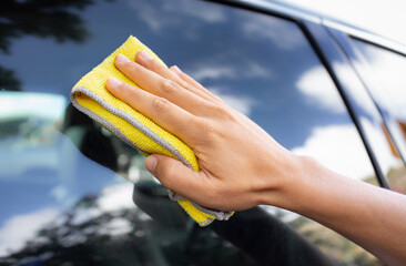 cleaning the car window. Car detailing care service concept 