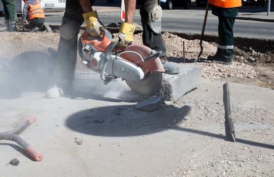 Photo Of Workers And A Pavement Under Repair