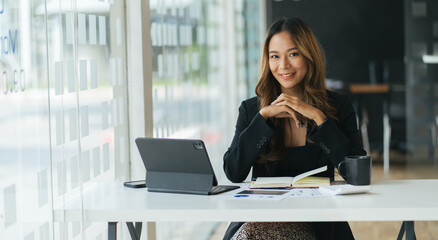 A young woman working with a laptop in a coffee shop business idea financial girl accountant