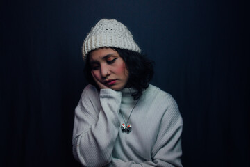 Fototapeta na wymiar Sad girl with sweater