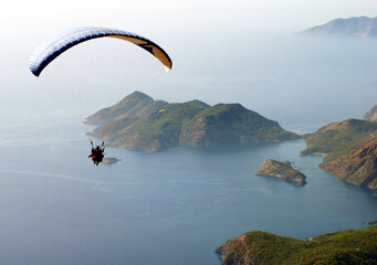 Paraglider fly from Mount Babadag in Fethiye, Turkey. Mount Babadag near Fethiye and a famous...