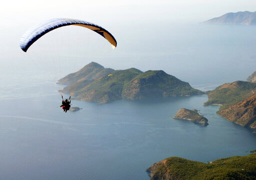 Paraglider fly from Mount Babadag in Fethiye, Turkey. Mount Babadag near Fethiye and a famous paragliding area in Turkey.