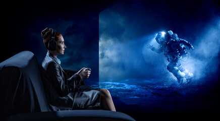 Obraz na płótnie Canvas Passionate female gamer with controller . Mixed media