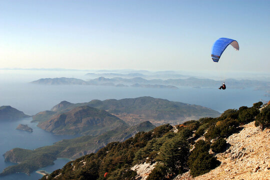 Paraglider fly from Mount Babadag in Fethiye, Turkey. Mount Babadag near Fethiye and a famous paragliding area in Turkey.