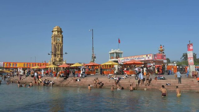 Haridwar, Uttarakhand, India - 10th April 2021 : View of Hindu devotees bathing in Har Ki Pauri Ghat, Holy river Ganges, on the occassion of Kumbh Mela. Ritual is called shaahi snan or Kumbh snan.