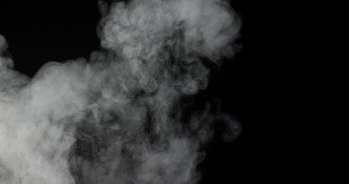 An explosion of dust from the ashes on a black background.