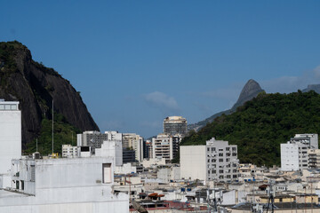 Fototapeta premium Copacabana beach, Rio de Janeiro, Brazil. Beautiful seaside town with old white buildings. Drone aerial view.